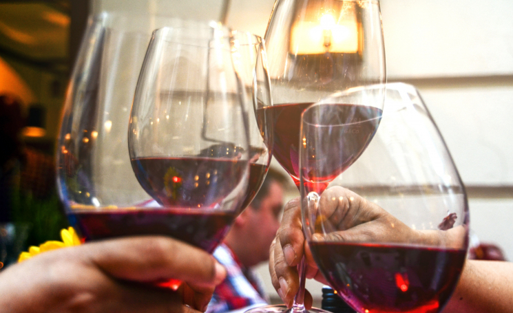 Four-wine-glasses-brought-together-for-a-toast-