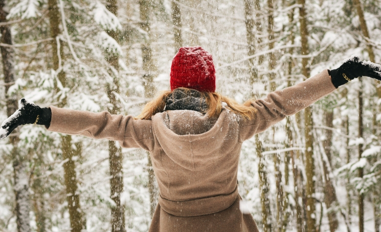 woman in snowy forest